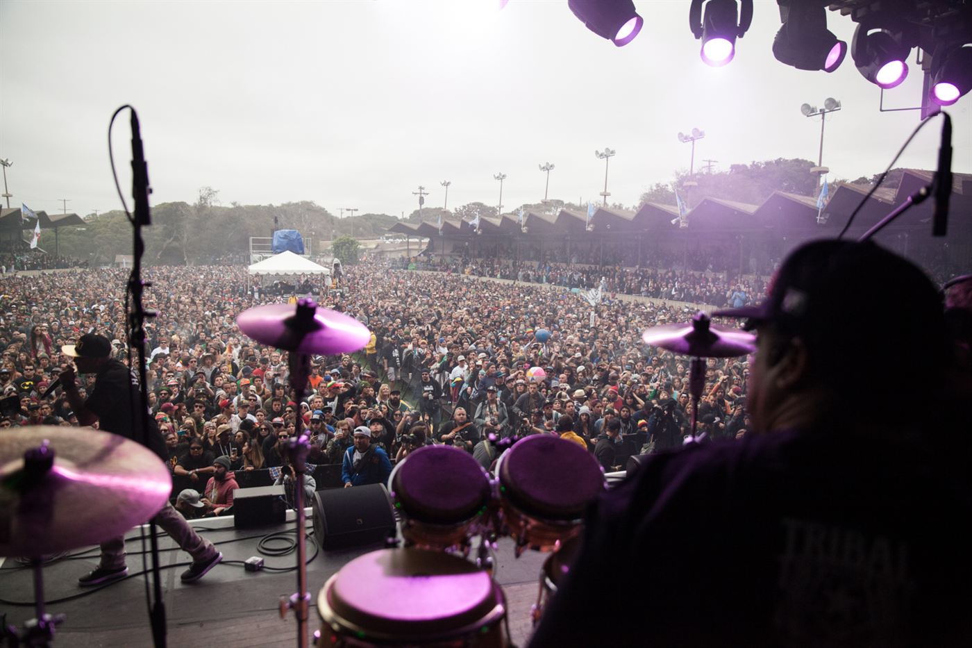 View from the stage over a festival crowd during a live performance.