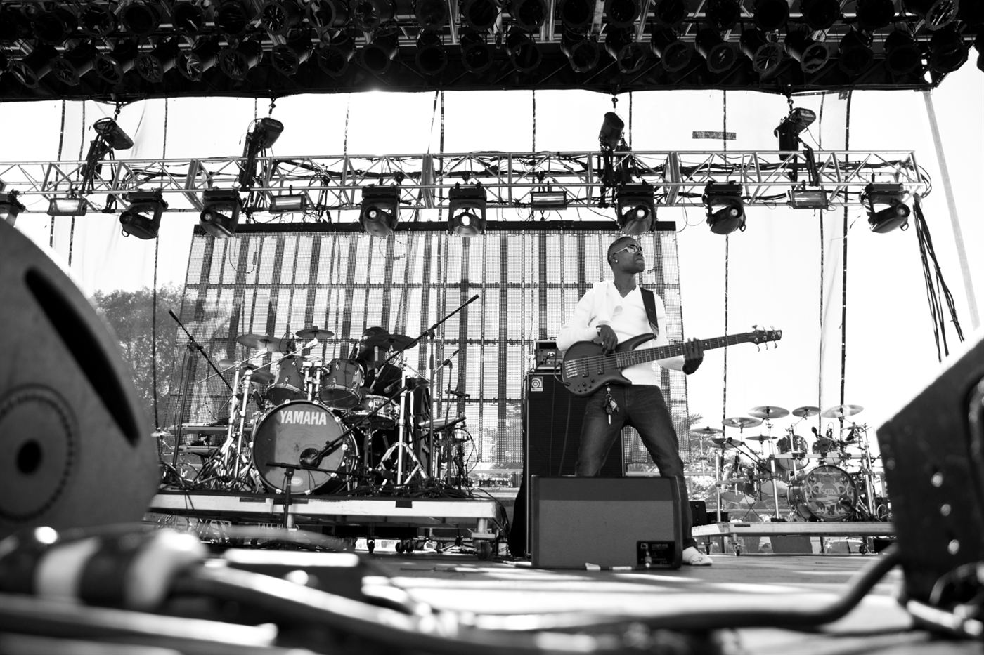 Bass player performing live on stage during the 9 Mile Music Festival in Florida.